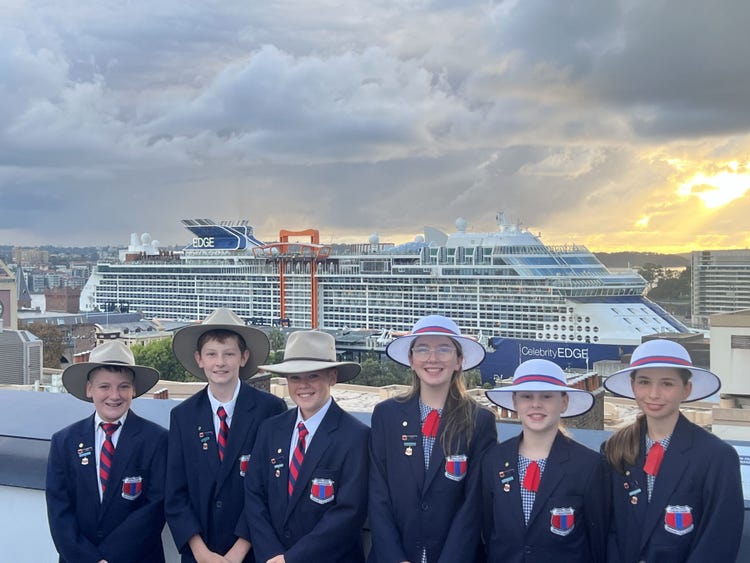 Student leaders dressed in formal school uniform, attending the Leadership conference.