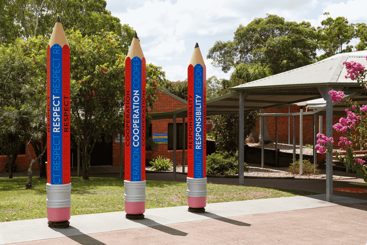 Image of three wooden pencils with school values, respect, cooperation and responsibility.